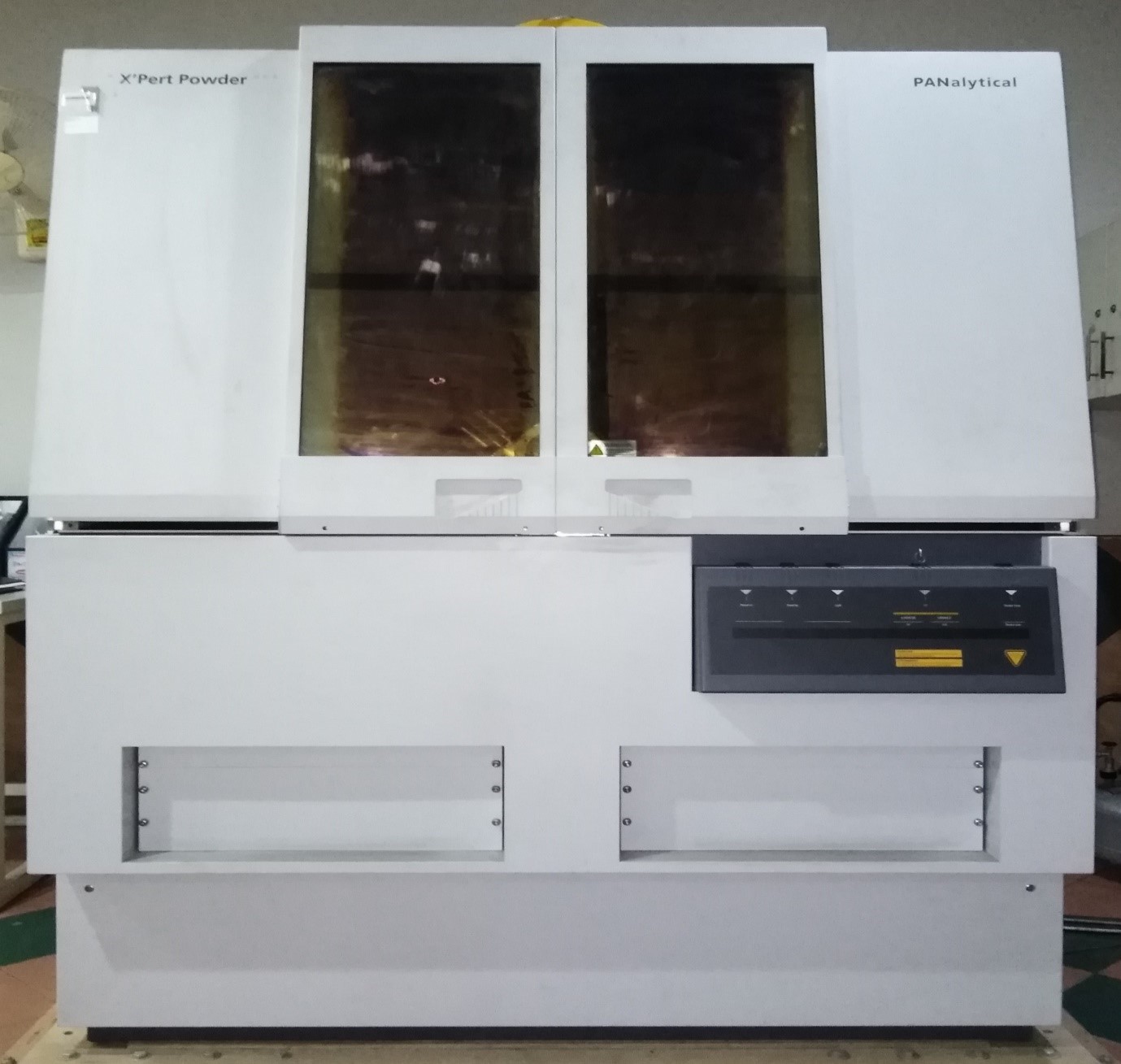 A white machine with a glass door  Description automatically generated